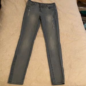 size 4 Light blue partially ripped jeans